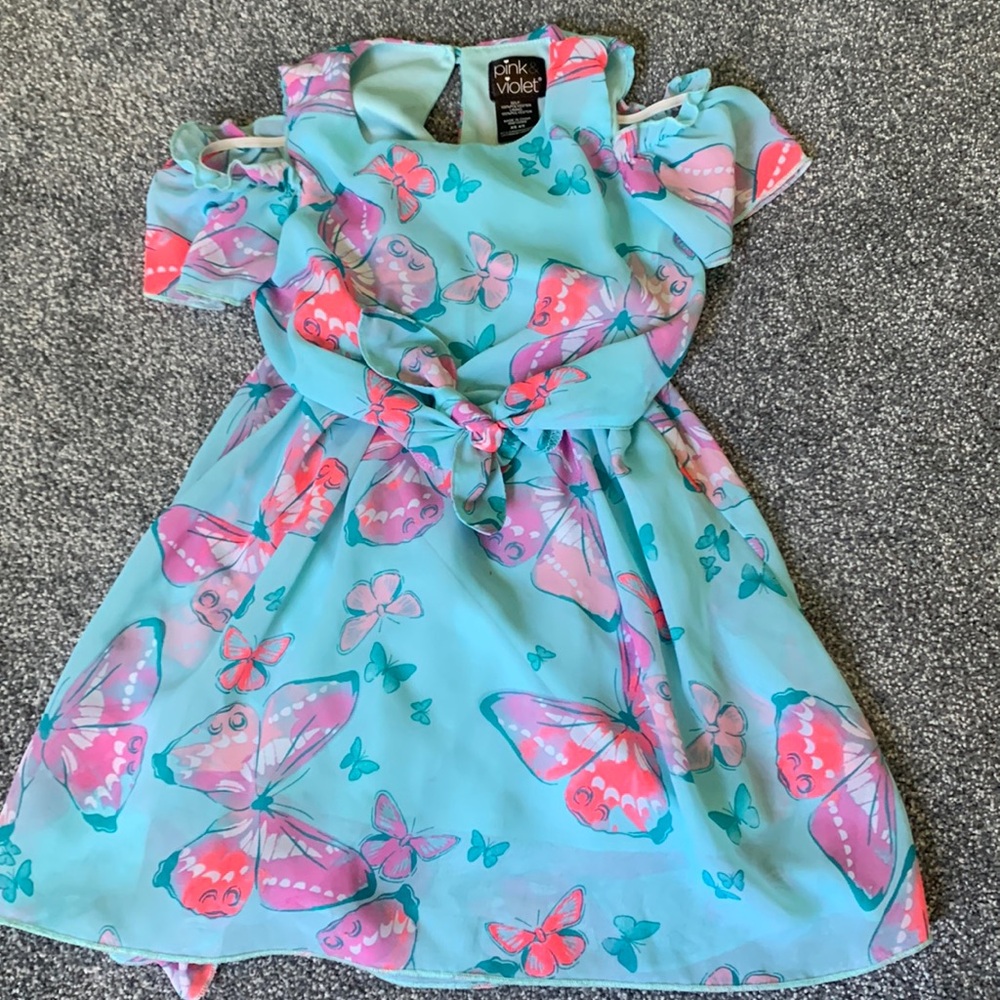 Girls light blue dress with butterfly pattern. Size XS or 4-5.